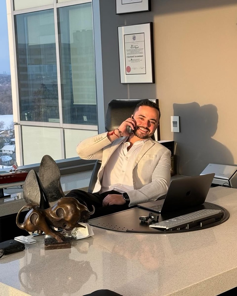Avi Grondin, founder of Variance Marketing, at his desk in the office
